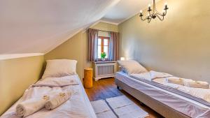 Posteľ alebo postele v izbe v ubytovaní Aparthotel STARA PIEKARNIA by ROYAL APARTS