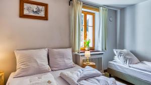 Posteľ alebo postele v izbe v ubytovaní Aparthotel STARA PIEKARNIA by ROYAL APARTS