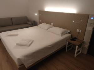 Letto o letti in una camera di Albergo Baschera