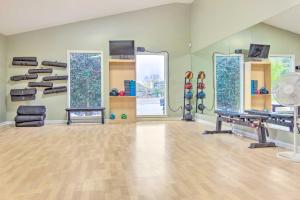 a room with mirrors and a gym with a treadmill at Hikers Hideaway Studio 1 Mi to Lake Lure! in Lake Lure