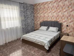 Кровать или кровати в номере Caspian Villa Merdekan