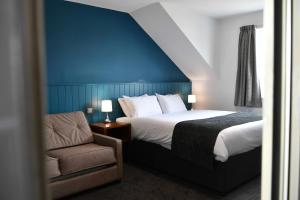 מיטה או מיטות בחדר ב-Mill On The Soar by Greene King Inns