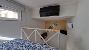 Ένα ή περισσότερα κρεβάτια σε δωμάτιο στο Family Surf Home - Casa do Páteo 5