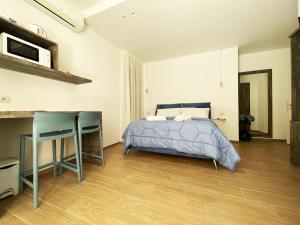 Postel nebo postele na pokoji v ubytování Sunny House - De Vivo Realty Sorrento