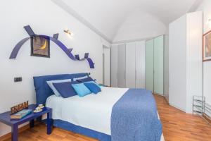 A bed or beds in a room at San Salvario Family Apartment by Wonderful Italy