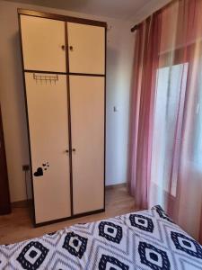 Postel nebo postele na pokoji v ubytování Apartmani Petra