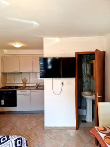 Kuchyň nebo kuchyňský kout v ubytování Apartmani Petra