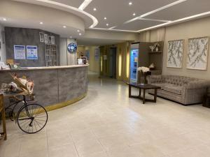 a lobby of a hospital with a bike parked in the lobby at Hotel Mediterraneo in San Miguel de Tucumán