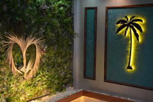 a room with a palm tree on the wall at Palmiye Suite Hotel Bakirkoy City Center in Istanbul +11 photos