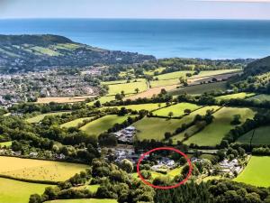 a house in the middle of a field with a red circle at The Barn and Pinn Cottage in Sidmouth