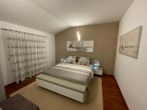 Postel nebo postele na pokoji v ubytování Apartments Ozrenka
