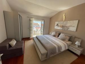 Postel nebo postele na pokoji v ubytování Apartments Ozrenka