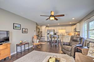 a living room with a couch and a ceiling fan at Stylish Pine Plains Home Near Parks and Hiking! in Pine Plains