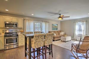 a kitchen and living room with a ceiling fan at Stylish Pine Plains Home Near Parks and Hiking! in Pine Plains