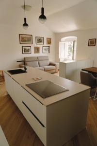 a kitchen and living room with a counter top at Appartamento Villa Cristina in Genoa