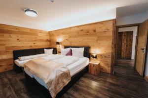 Llit o llits en una habitació de ApartKlusiv Kaltenbach