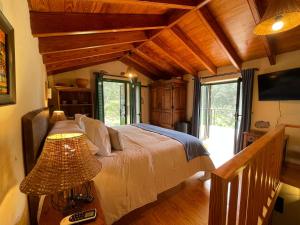 a bedroom with a large bed in a house at Dúplex de invitados en medio del bosque in Firgas