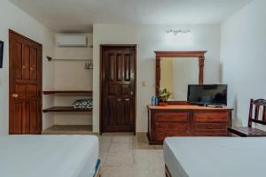 TV a/nebo společenská místnost v ubytování Hotel Santa María Mérida