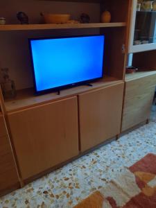 TV a/nebo společenská místnost v ubytování La casa di Rosa - Casa Vacanze