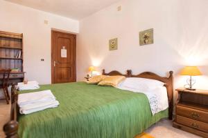 Ένα ή περισσότερα κρεβάτια σε δωμάτιο στο Rooms&terraces Urzulei