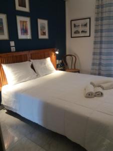 Ένα ή περισσότερα κρεβάτια σε δωμάτιο στο apartment in poros +6 φωτογραφίες