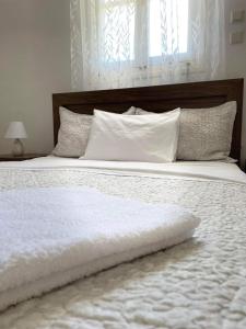 Een bed of bedden in een kamer bij Casa Dino Bello