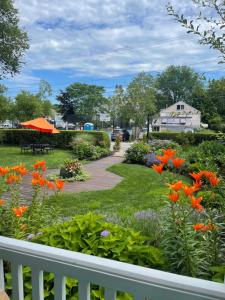 
a park filled with lots of flowers on a sunny day at Stowaway in Provincetown
