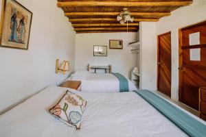 Postel nebo postele na pokoji v ubytování Hotel Fundo El Arrabal