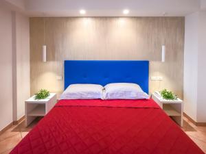 Voodi või voodid majutusasutuse Hotel Martino toas