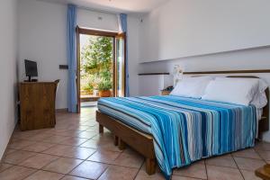 Voodi või voodid majutusasutuse Hotel Martino toas