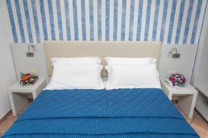 Voodi või voodid majutusasutuse Hotel Martino toas