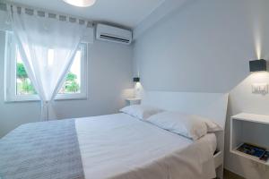 Postel nebo postele na pokoji v ubytování Citrarium B&B - Apartaments