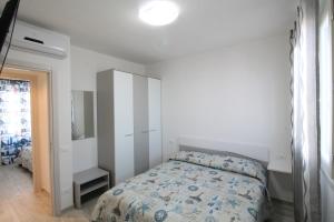 Krevet ili kreveti u jedinici u objektu Appartamenti LE TRE ISOLE con Terrazza Vista Mare