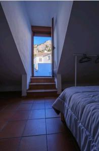 Postel nebo postele na pokoji v ubytování Sendero de la Subbetica - Apartamentos Turisticos en Zuheros - Holiday Home