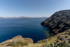 a view of a large body of water from a cliff at Evanthia Best View Thirassia Island Hotel in Therasia