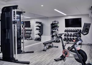 a room with a gym with a exercise bike at The Loutrel in Charleston