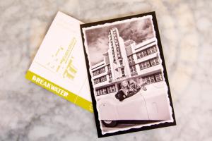 a book with a picture of a building on the side at Hotel Breakwater South Beach in Miami Beach