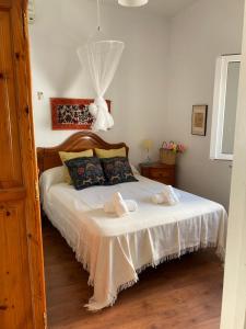 Postel nebo postele na pokoji v ubytování Casa Amparo casco histórico