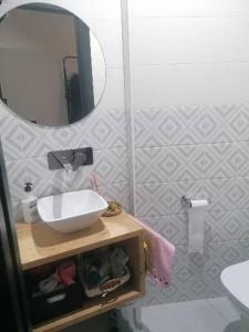a bathroom with a sink and a mirror at Casiña da Madalena in Ribadavia
