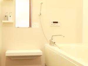 a white bathroom with a sink and a bath tub at Chiba - House - Vacation STAY 41221v in Chiba