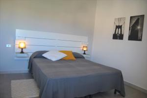 En eller flere senge i et værelse på Giglio di Mare