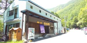 a building on the side of a mountain at Yasha Gami Hutte - Vacation STAY 36327v in Minami Alps