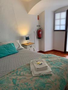 Voodi või voodid majutusasutuse Casa dos Tios toas