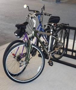 a bike is parked next to a fence at Crystal Tower 1408 - Lazy River, Beachfront pool, Amazing Views, New Upgrades!! in Gulf Shores