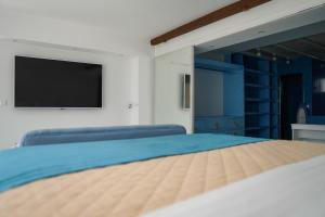 Кровать или кровати в номере Boathouse