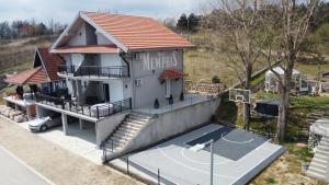 an overhead view of a house with a basketball court at Vila Memphis in Golubac