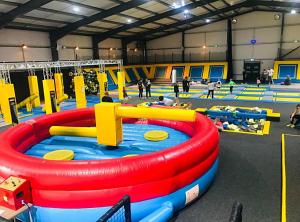 a gym with people playing in an inflatable pool at Pack and go holidays in Ingoldmells