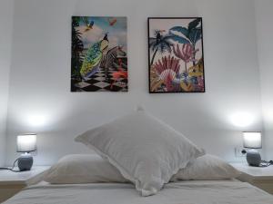 A bed or beds in a room at Los Cristianos - heated swimming pool air-conditioned