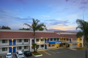 a hotel with a parking lot in front of it at Motel 6-Santa Maria, CA - North in Santa Maria