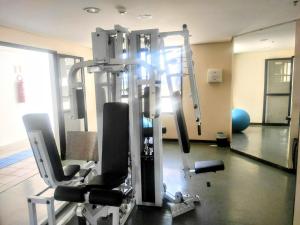 a room with a gym with two tread machines at Condomínio Master Metropolitan -Centro de Brasília in Brasilia